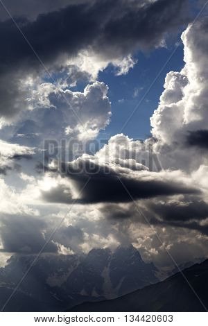 High Mountains Before Rain And Sunlight Clouds