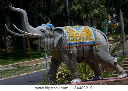 statue of Thai Indian Elephant wearing traditional Thai decorations at the Songkhla Zoo, Thailand