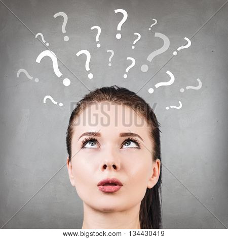 Thoughtful confused beautiful woman has too many questions and no answer
