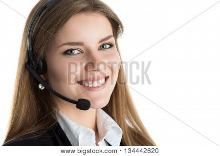 Portrait of young beautiful call center worker talking to someone. Smiling customer support operator at work. Help and support concept. Portrait over white background