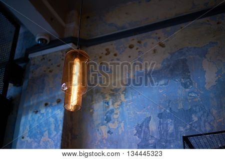 modern designer decorative lighting against old wall