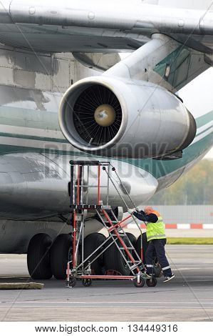 Service Engineer Serves A Jet Engine