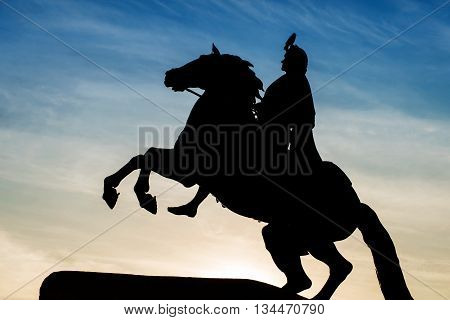 Peter the Great monument the Bronze Horseman. Silhouette against the twilight sky with crow on it. St. Petersburg Russia