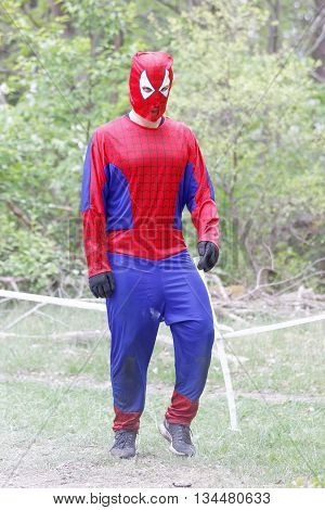 STOCKHOLM SWEDEN - MAY 14 2016: Man dressed as Spiderman participate in the obstacle race Tough Viking Event in Sweden May 14 2016