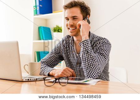 Happy Young Man Having Talk With His Clients