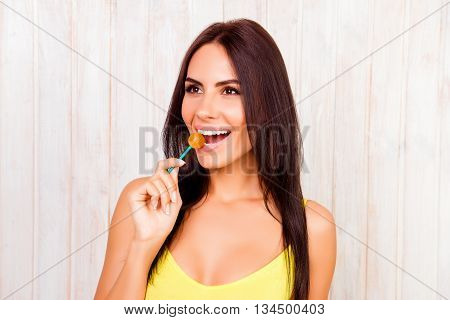 Portrait Of Happy Pretty Woman Licking Chupa Chups