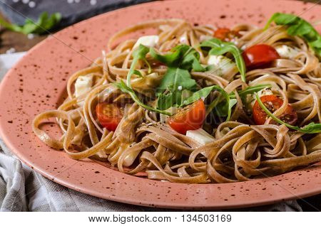 Spaghetti With Mozzarella, Cherry Tomatoes And Arugula