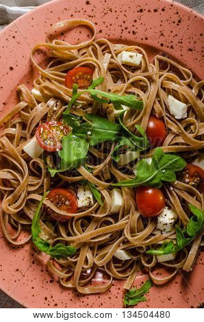 Spaghetti With Mozzarella, Cherry Tomatoes And Arugula