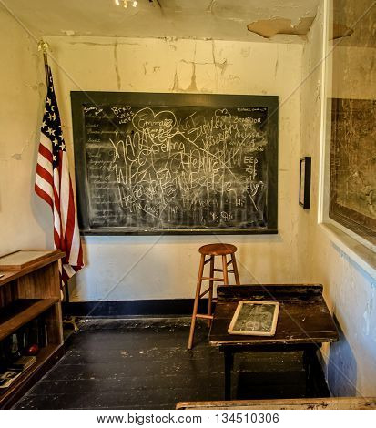 Fayette, Michigan, USA - June 13, 2016: Interior of an abandoned classroom in the ghost town of Fayette, located in Michigan's Upper Peninsula.