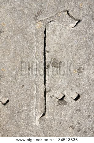 Cyrillic symbol G on granite slab. Ukraine Zolochev Carpathian