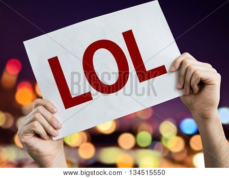 LOL placard with night lights on background