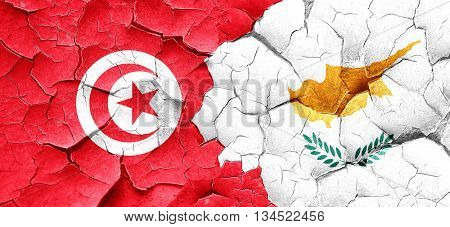 Tunesia flag with Cyprus flag on a grunge cracked wall