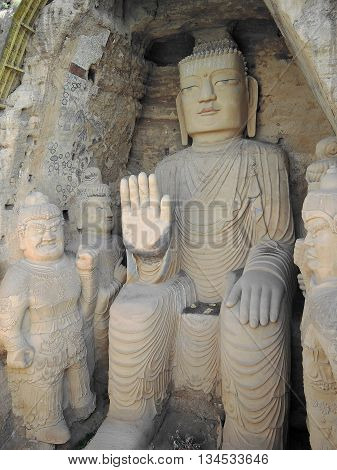 The 28 m Giant Buddha (Dafo) of buddhist cave complex Tiantishan (Tiantishan Grottoes) is located approximately 55 km south-east of Wuwei (Gansu, China) on the rocky eastern shore of the Huangyang reservoir, 12 m below the water level.