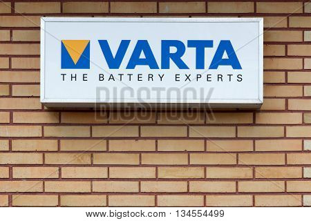 Nykobing, Denmark - June 12, 2016: Varta logo on a wall. Varta is a German company manufacturing batteries for global automotive, industrial, and consumer markets.