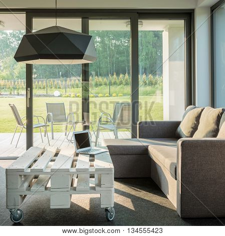 Spacious living room with comfortable sofa and stylish table