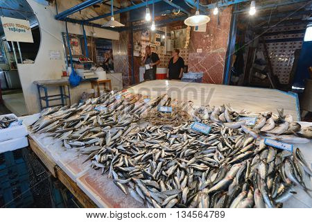 CHANIA GREECE - AUGUST 12: Unknown people sell fresh fish in Chania Crete Greece on 12 August 2014. The cross-shaped market (Agora) of Chania was built in 1911-1913.