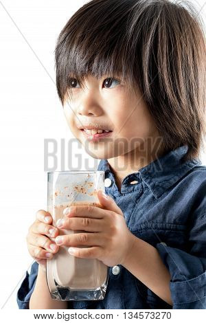 Close up portrait of cute asian boy holding glass with chocolate milk.Isolated on white background.