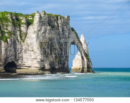 Cote d'Albatre or Alabaster Coast is part of the French coast of the English Channel. Famous cliff Porte d'Aval. Etretat France