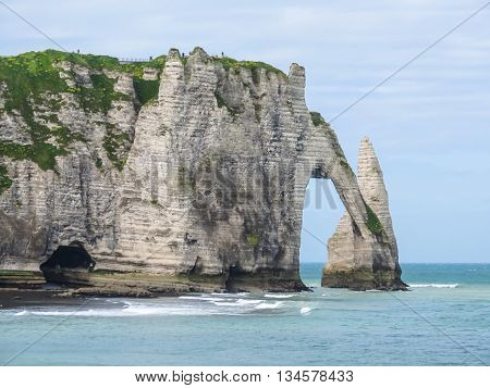 Cote d'Albatre or Alabaster Coast is part of the French coast of the English Channel. Famous cliff Porte d'Aval. Etretat France