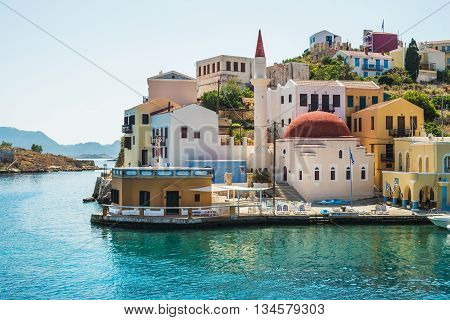 View over the houses and mosque on Greek islands Kastelorizo and the sea from the bay
