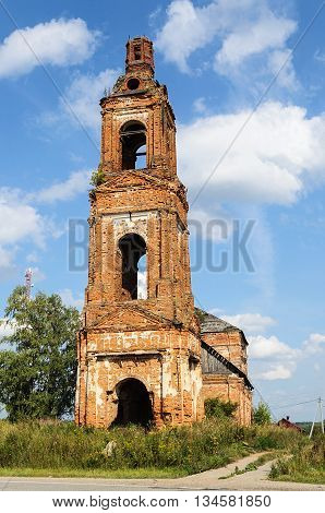 Old destroyed bell tower of Church of the Dormition in the village Voron'e Kostroma region Russia