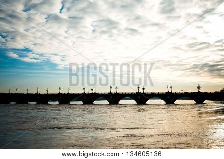 Old stony bridge in Bordeaux, France Europe