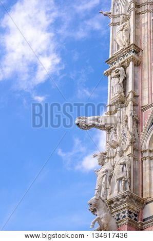 Architectural details of Duomo facade - SienaTuscanyItaly. The Duomo of Siena which was built in the 12th and 13th centuries is one of the prettiest churches in Gothic style in Italy