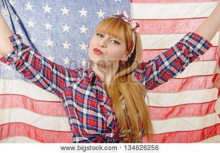 a sexy pin up girl isolated holding an American Flag