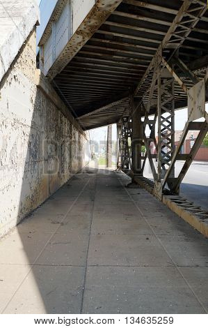 Pedestrians may walk through the Scott Street Viaduct near downtown Joliet, Illinois.