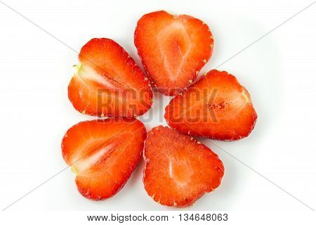 Slices of strawberry on white. Juicy strawberries for packaging. Eco-friendly food