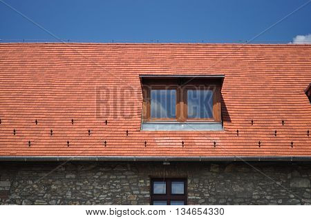 Window on the tile with blue sky background close-up