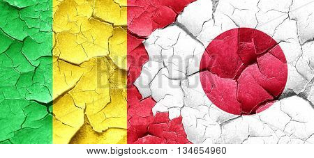 Mali flag with Japan flag on a grunge cracked wall