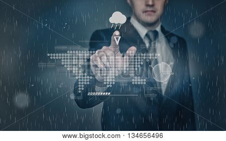 Businessman checks weather forecast. Touching the touch screen with the projection of graphic world map representation. Chance of precipitation as rain. Innovative technology. Digital presentation