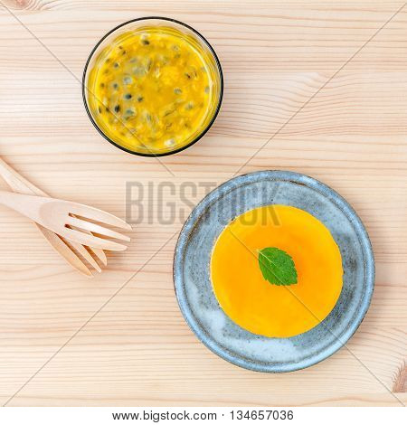 Passion Fruit Cheesecake With Fresh Mint Leaves On Wooden Background. Passion Fruit Cheesecake Setup
