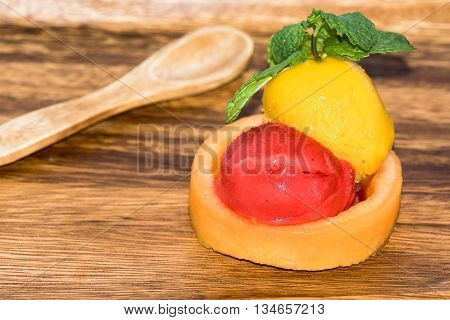 Raspberry sorbet, mango sorbet with fresh cantaloupe