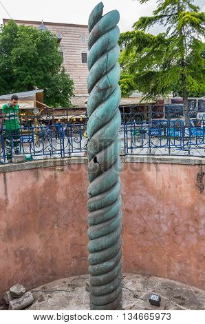 ISTANBUL TURKEY - JUNE 19 2015: The Serpent Column also known as the Serpentine Column is an ancient bronze column at the Hippodrome of Constantinople in Istanbul Turkey