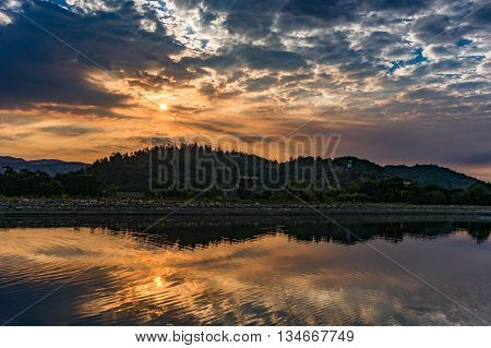 Sunrise reflected in a resevoir during a Napa Valley Harvest