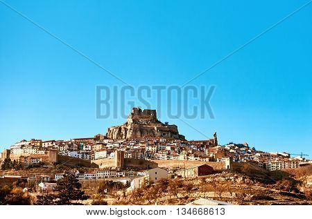 Morella skyline. Morella is an ancient gothic city located on a hill-top in the province of Castellon Valencian Community Spain. Morella is in the heart of the historic region of Meastrazgo and it is listed as one of the most beautiful towns in Spain