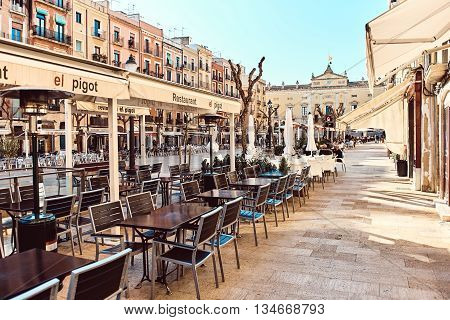 Tarragona Spain- March 23 2016: Town square in the old town center of Tarragona. It is popular touristic place with a plenty of restaurants and bars
