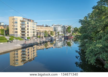 LINKOPING, SWEDEN - JUNE 3, 2016: Summer morning by river Stangan in Linkoping. Linkoping is a famous University town in Sweden.