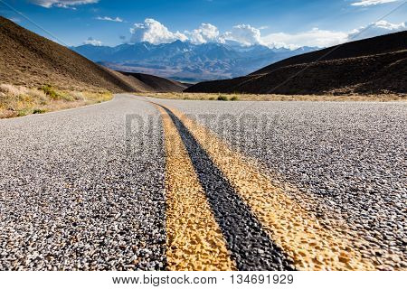 Road close-up and distant mountains on the horizon