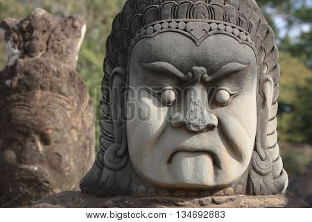 Carved guardian of Angkor Wat temple in Siem Reap, Cambodia
