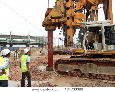MALACCA, MALAYSIA - MARCH 12, 2015: Bore pile rig machine at the construction site in Malacca, Malaysia. The machine used to driven pile for building foundation work.