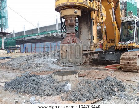MALACCA, MALAYSIA - MARCH 12, 2015: Bore pile rig machine at the construction site in Malacca, Malaysia. The machine used to driven pile for building foundation work.