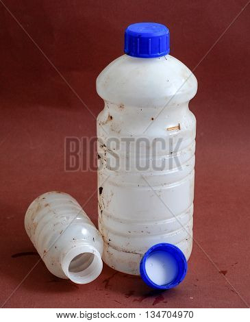 picture of a Dirty Bottle of chemical liquid