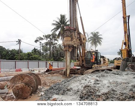 MALACCA, MALAYSIA - MARCH 12, 2015: Bore pile rig machine at the construction site in Malacca, Malaysia. The machine used to driven pile for building foundation work.