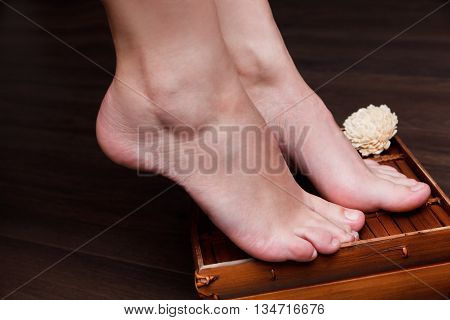 Close-up of a beautiful well-groomed woman's feet with natural pedicure