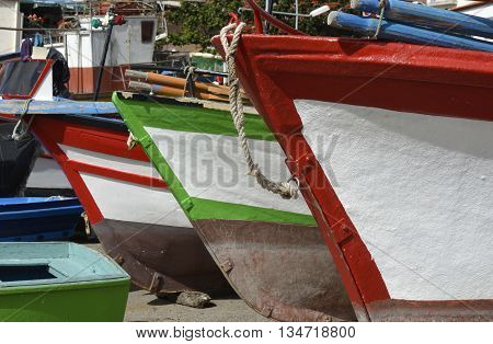 Fishing boats drawn up on beach and slipway at Camara de Lobos in Madeira Portugal