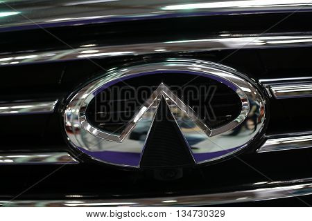CRACOW POLAND - MAY 21 2016: Infiniti metallic logo closeup on Infiniti car displayed at 3rd edition of MOTO SHOW in Cracow Poland. Exhibitors present most interesting aspects of the automotive industry