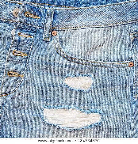 Close-up blue denim with a pocket .Blue jeans fabric .